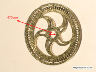 Test cut of a customized brass watch gear Test cut of a customized brass watch gear